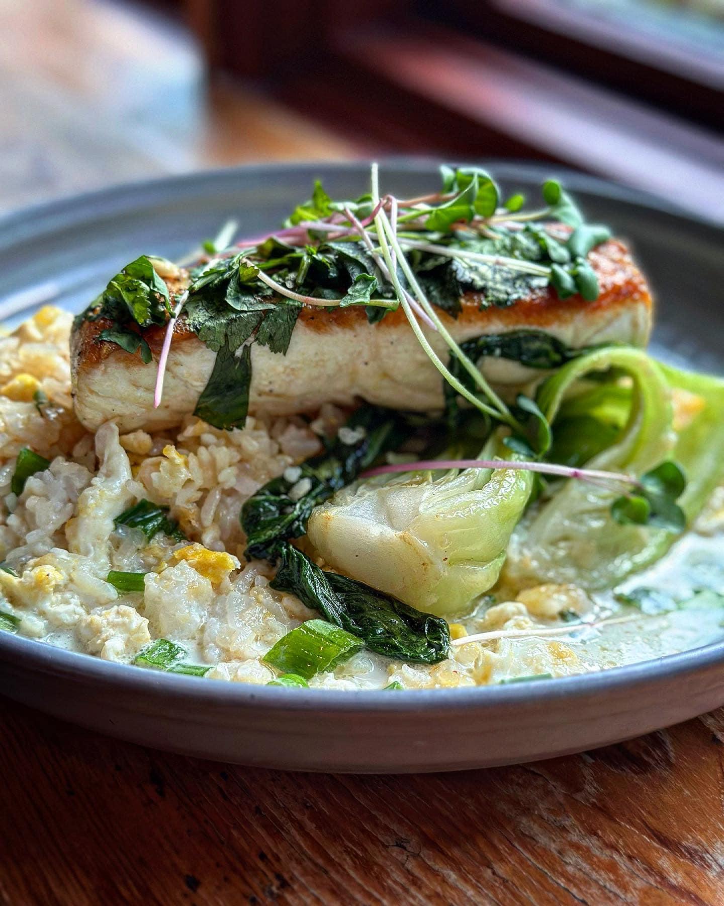 NEW MENU ITEM!! Try our Pan Roasted Halibut served lump crab fried rice, bok choy, lemon grass & in ginger broth! Try this and many other of our tasty menu items. Book your reservation today! 